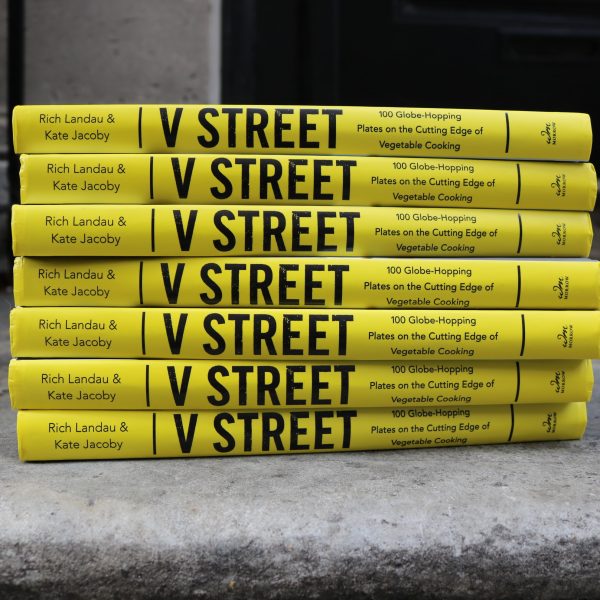 Stacked spines of V Street cookbook