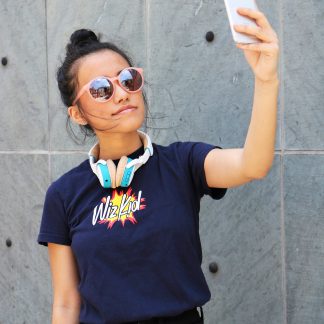 Model wearing navy wiz kid t shirt taking selfie