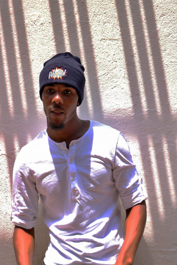 Model wearing navy wiz kid beanie