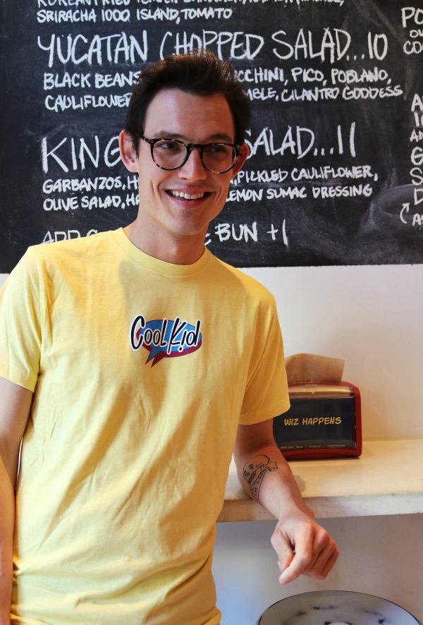 Model wearing yellow Cool Kid t-shirt